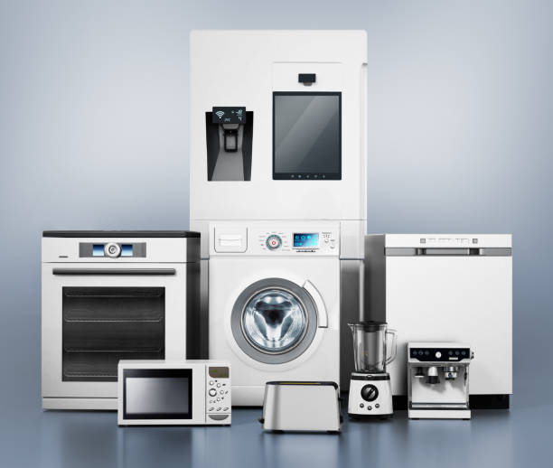 反射面に立つ現代家電製品のセット - appliance repairing clothes washer refrigerator ストックフォトと画像