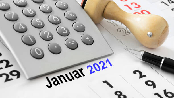 istock Calendar and calculator and German: January 2021 1279458024
