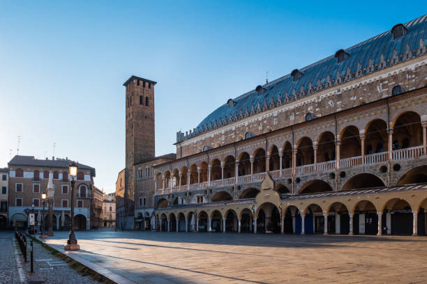 Padua, Italy - August 16 2020: Palazzo della Ragione Palace on Piazza della Frutta Square with Torre degli Anziani