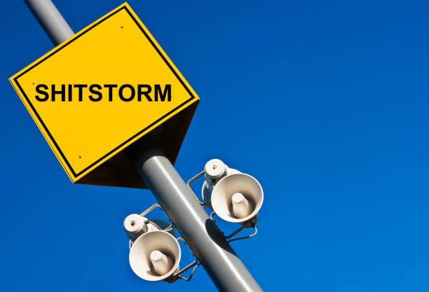 Shit storm sign against blue sky background
