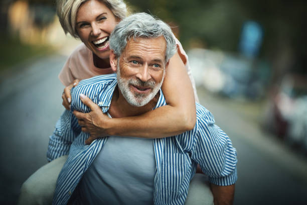 Middle aged couple having fun outdoors.