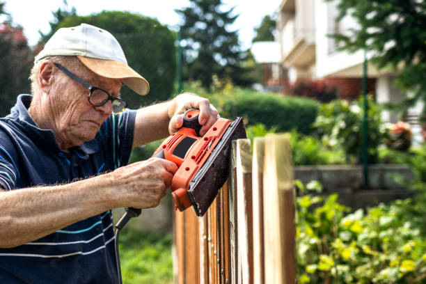 istock Active senior man repairing old picket fence 1279459985