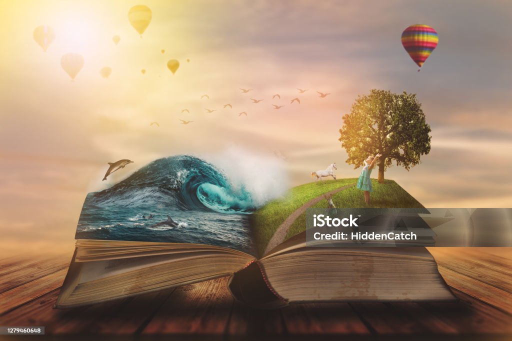 Concept of an open magic book; open pages with water and land and small child. Fantasy, nature or learning concept, with copy space Book Stock Photo