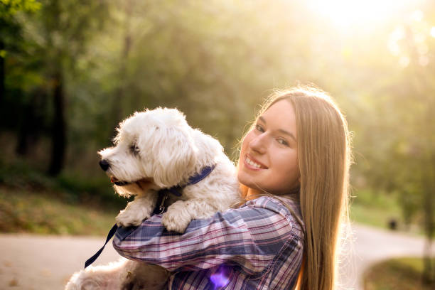 istock Young woman and her pet dog 1279464114