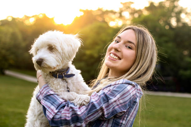 istock Smiling young woman and her dog 1279464183