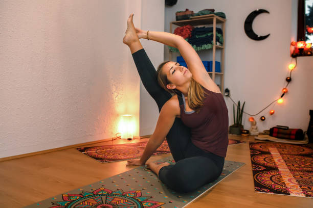 istock Beautiful young woman practices yoga 1279467590