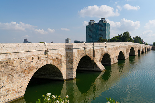 Adana/Turkey- September 13 2020: The Stone Bridge on Seyhan River
