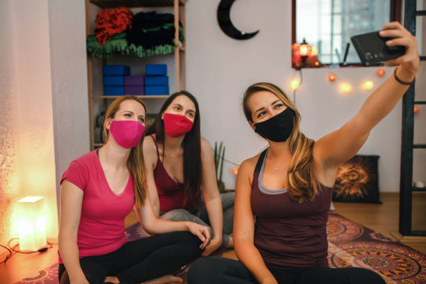 istock Happy girlfriends group taking selfie after yoga exercise 1279467929