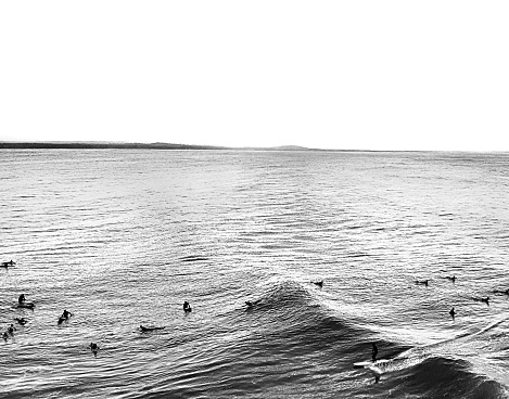 A cyclone swell hits the East coast of Australia proving good waves which are enjoyed by surfers in the hot Australian sun