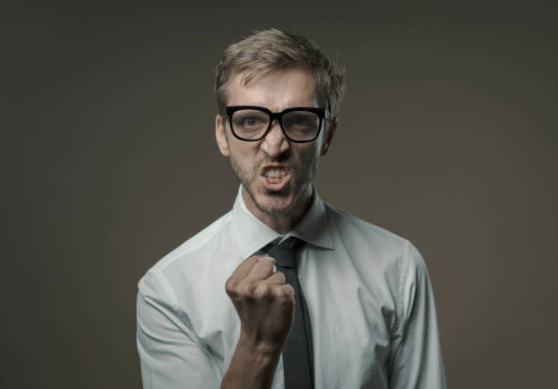 istock Angry aggressive businessman looking at camera 1279471675