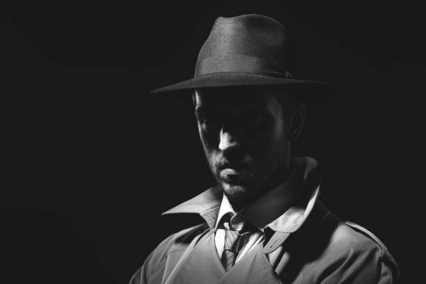 istock Noir film detective posing in the dark 1279471793