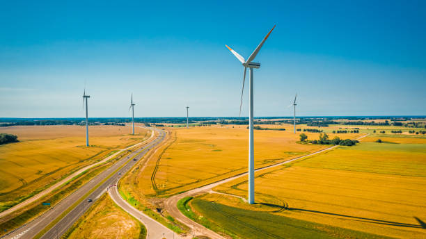 istock Wind turbines and highway in summer, aerial view 1279476033