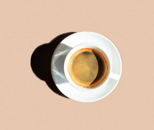 istock White cup of coffee with a saucer on a beige background 1279478152
