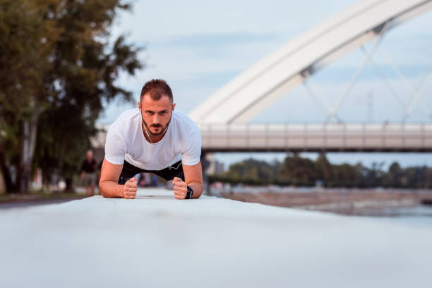 istock Fit man in a plank position near the bridge 1279478245