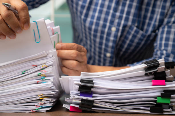 istock Business man pick up Stack overload document report paper, business concept 1279478877