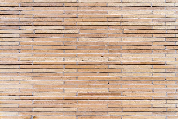 istock New, rustic brown and beige brick or tile wall. 1279479178