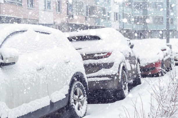 istock parked car in the yard covered with snow 1279479338