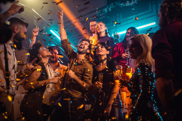 We are going to party as if there's no tomorrow Group of energetic young people dancing at a party in a nightclub party stock pictures, royalty-free photos & images