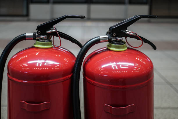 istock Close up on fire extinguisher in the city's Public transportation. 1279485009