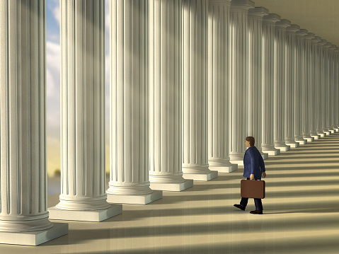 Businessman walking through a column lined walkaway . Digital illustration.