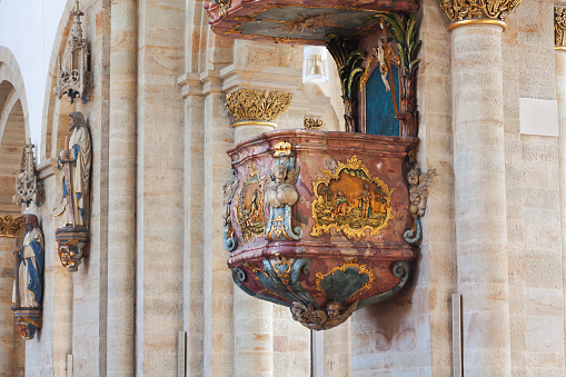 Old wooden pulpit with Aopstle Peter in cathedral Osnabrueck