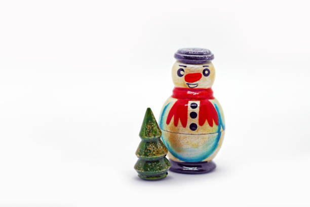 Traditional wooden russian toy. Nesting dolls - snowman and christmas tree. Popular souvenir from Russia.