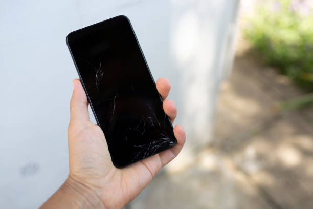 istock Point of view holding smashed smartphone in hand 1279488573