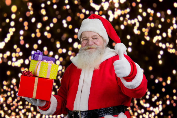 istock Santa with gifts showing thumb up. 1279490356