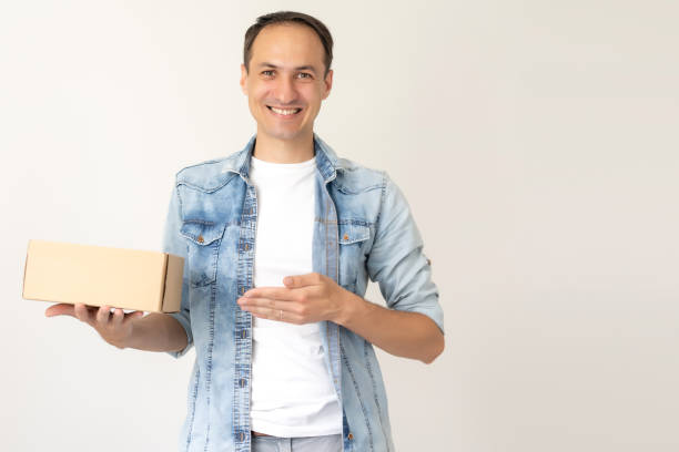 istock man carries the box, isolated, white background 1279491280