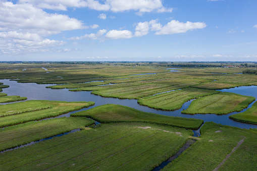 aerial view of  over historic dutch waterland landscape in may, the ilperveld near den iip and landsmeer the  netherlands