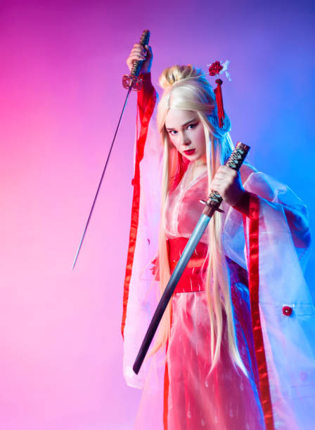 istock a woman dressed as a geisha with a katana 1279491543