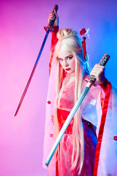 istock a woman dressed as a geisha with a katana 1279491545