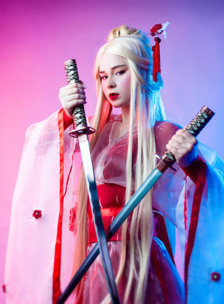 istock a woman dressed as a geisha with a katana 1279491547