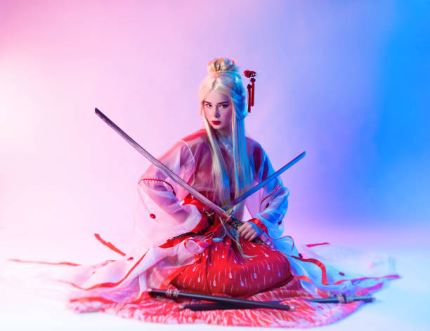 istock a woman dressed as a geisha with a katana 1279491550