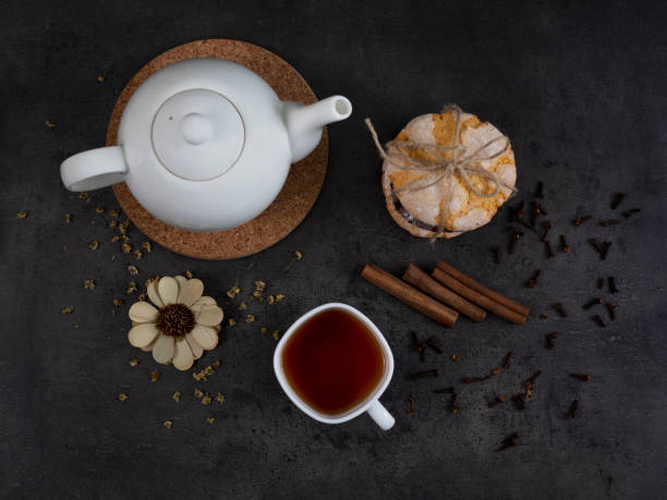 istock White teapot with a cup and cookies. 1279492245