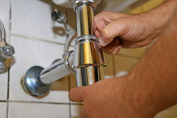 istock Plumber installs the syphon on a sink 1279493507