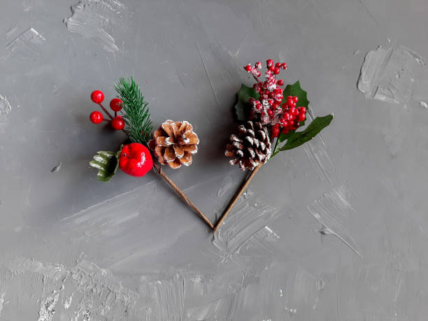 istock Branch with red berries on a gray background, autumn 1279495874