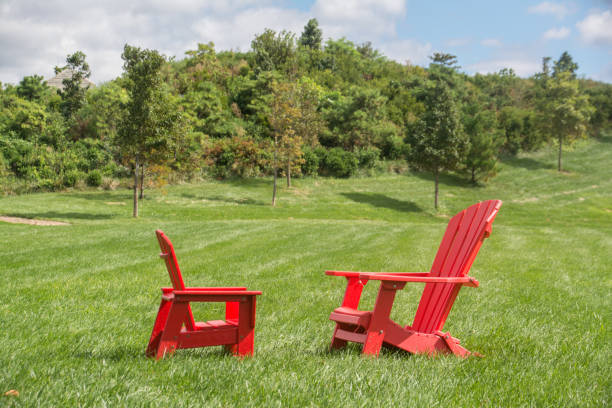 istock Red Lawn Chairs on Green Lawn 1279497280