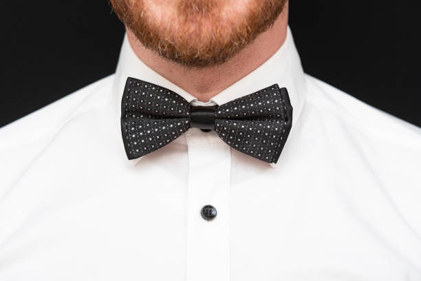 istock Redhead man with red beard dressed in black bowtie and white shirt 1279502659
