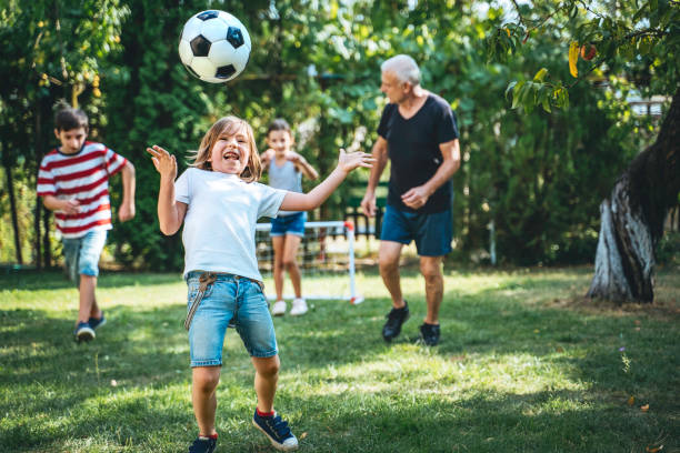 istock Family playing soccer in the back yard. 1279504918