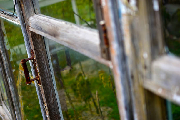 istock Old window frames and rotten arms and hinges 1279506246