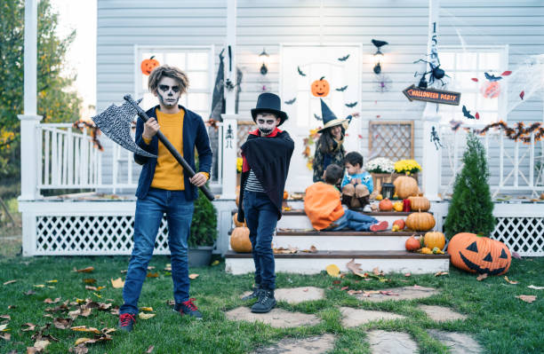 istock Young kids trick or treating at night during Halloween 1279510269