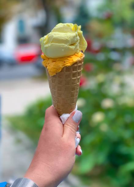 istock Ice cream in woman hand 1279510790
