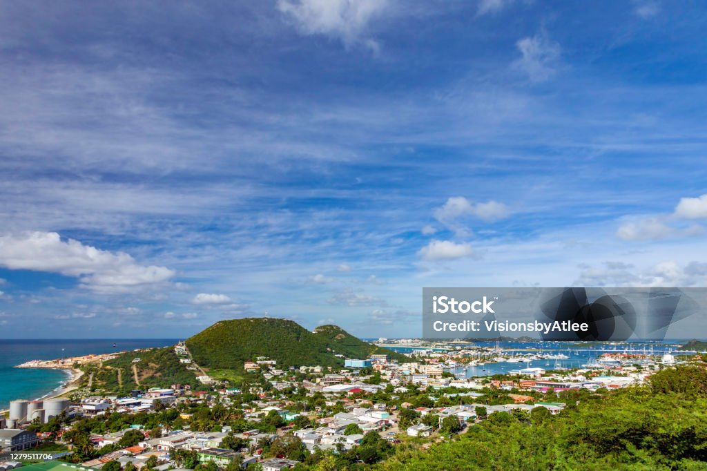 View from a hilltop of St Maartin, Netherlands Antilles with a view of the City, and Marina below and the Airport (SXM) in the distance St. Kitts Stock Photo