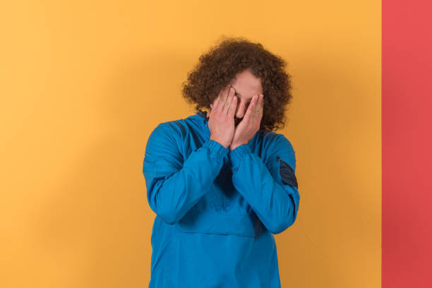 istock Carefree happy young men closed face over colored wall 1279512873