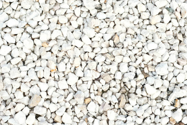 istock Drainage systems from small pebbles. Garden drainage for plants and trees. White stones for roads and flower beds. 1279514297