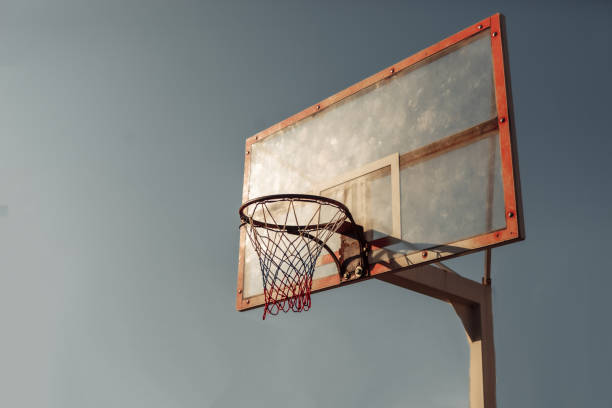 istock Basketball hoop against the sky. Bright sunshine 1279518965
