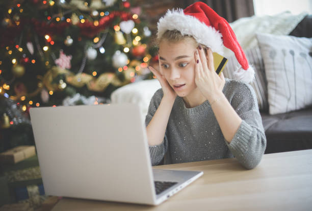 istock young woman in christmas interior with laptop  ( e-commerce) 1279521652