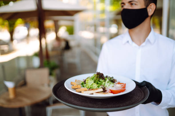 istock Salad on a waiter's tray. Covid- 2019. 1279522314