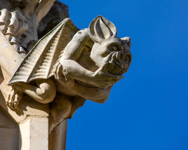 Ornate Sculpture at Gloucester Cathedral in the UK Close-up of stone carvings at the historic Gloucester Cathedral in Gloucester, UK. fanged stock pictures, royalty-free photos & images